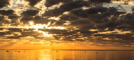 Unusual sunset on the sea. Sea sunset background. Evening sunset Sea and sky. Beautiful sunset. Fiery sky Sky and clouds.の写真素材