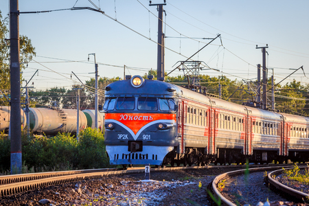 The train is on the rails in the evening. Russian railway. Electric train Russia, Leningrad region, Gatchina, August 8, 2018のeditorial素材