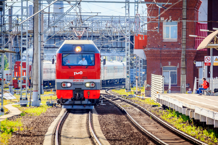 Locomotive goes on rails. Russian train. Russian railway. Locomotive. Russia St. Petersburg August 7 2018のeditorial素材