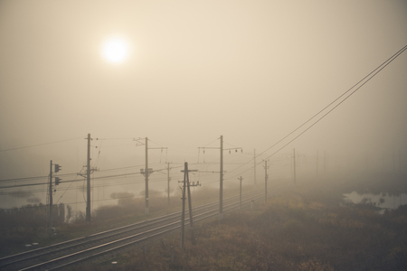 Fog on the railway. Foggy Russian railway. Morning fog. Heavy fogの写真素材