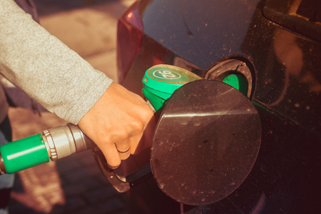A man fills the car with gasoline. The man at the gas station. Refueling machines. Gasoline at a gas station, Russia, Gatchina, September 19, 2018のeditorial素材