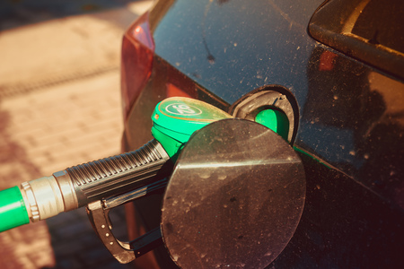 A man fills the car with gasoline. The man at the gas station. Refueling machines. Gasoline at a gas station, Russia, Gatchina, September 19, 2018のeditorial素材