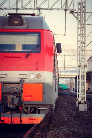 Locomotive rides on the Russian railway at sunset. Russian railway. Railway at sunset. Russia, Leningrad region, the village of Lyuban, evenings April 6 and 7, 2018のeditorial素材