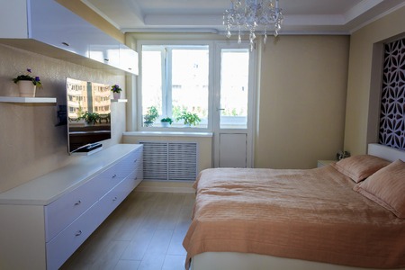 Bright bedroom. Bedroom in white and beige tones. Light room. The interior of the bedroom. Russia, St. Petersburg, June 16, 2018のeditorial素材