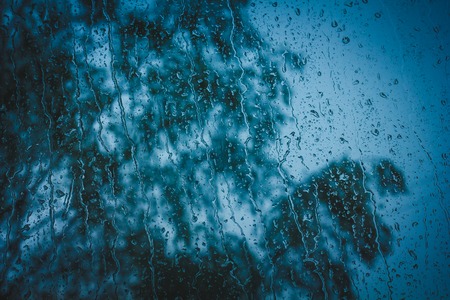 Drops of water on the glass. Drops on the window. Water drop background.の写真素材