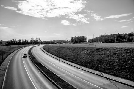Highway. Track with cars. Car track at sunset. Cars go on the road. Russia, Leningrad region, St....