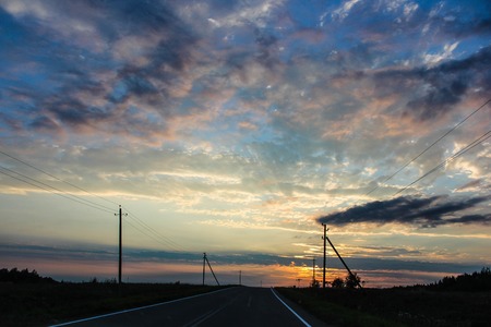 Unusual beautiful sunset over the road. sunset and road. Beautiful skyの写真素材