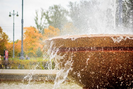City fountain. Water in the fountain. City decoration. Water jet. Bowl Fountainの写真素材