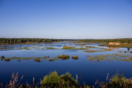 wide river in the village. open spaces of Russia. rivers and fieldsの写真素材