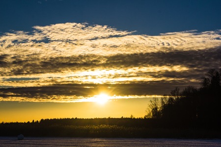 Sunset in the field. Sunset. Beautiful sky. Sunset background The sky and the sun.の写真素材