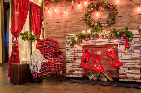 Christmas decoration of the hall in the restaurant. Holiday in the restaurant. New Year's decor. Red and green decorations. The decor of the room. The interior. Russia Big Kolpany, restaurant Chalet December 7, 2018のeditorial素材