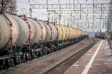 Locomotive rides outside the city. Shipping. Russian railway. Railway in the fall. Locomotive rides in the fall. Overcast weather . Russia Leningrad Oblast, Troopskovitsy Station on November 23, 2018のeditorial素材