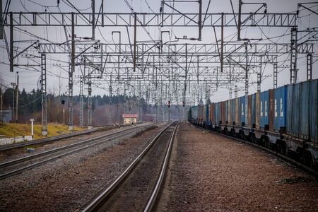 Locomotive rides outside the city. Shipping. Russian railway. Railway in the fall. Locomotive rides in the fall. Overcast weather . Russia Leningrad Oblast, Troopskovitsy Station on November 23, 2018のeditorial素材