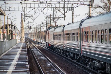 Russian train. Locomotive with cars. Passenger train. Public transport. Russia Metallostroy March 8 2019のeditorial素材