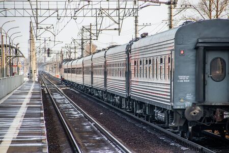Russian train. Locomotive with cars. Passenger train. Public transport. Russia Metallostroy March 8 2019のeditorial素材