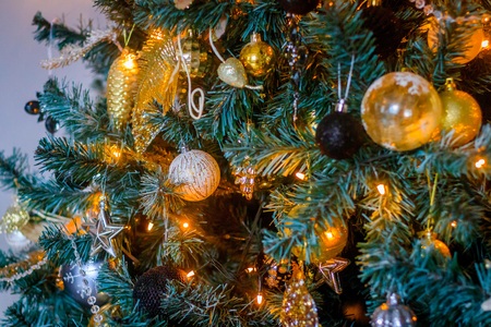 Toys on the Christmas tree. Dressed up Christmas tree. New Year's decorations. Holiday New Year and...
