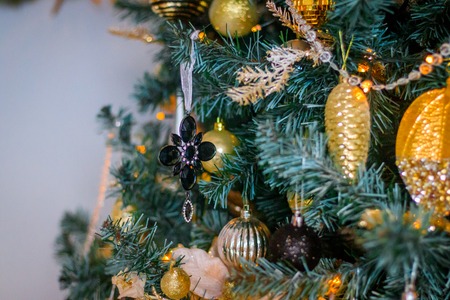 Toys on the Christmas tree. Dressed up Christmas tree. New Year's decorations. Holiday New Year and...