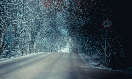 Winter Russian asphalt road. Winter road. Snowy road. Journey . Winter landscapeの写真素材