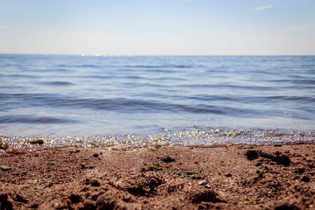 Sea in clear weather. Sea on a sunny day. Summer The Gulf of Finland. Small waves. Sea and beach. Background sea and sky blue.の写真素材