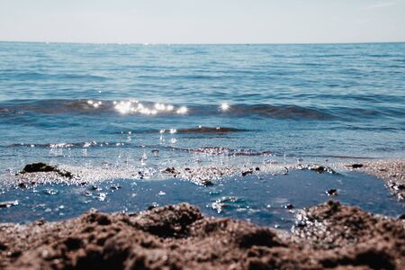 Sea in clear weather. Sea on a sunny day. Summer The Gulf of Finland. Small waves. Sea and beach. Background sea and sky blue.の写真素材