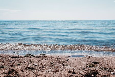 Sea in clear weather. Sea on a sunny day. Summer The Gulf of Finland. Small waves. Sea and beach. Background sea and sky blue.の写真素材