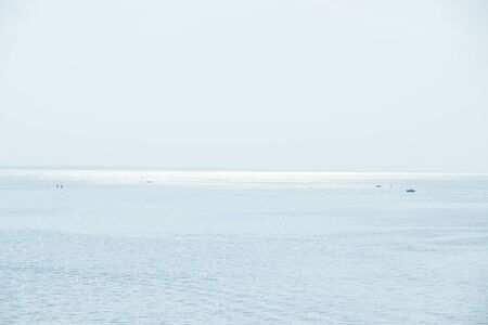 The Gulf of Finland . Summer sea in clear windless weather. Sea without waves. Shallow waterの写真素材