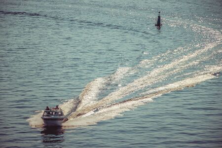 Boat on the sea. Track from the boat on the water. Leisure. Riding on a boat. Russia, St. Petersburg, Gulf of Finland June 5, 2019のeditorial素材