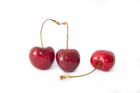 Sweet cherry berries isolated on whiteの写真素材