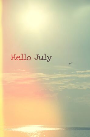Banner hello july. New month. Welcome card Evening summer sunset. Summer landscape.の写真素材