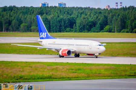 Airplane at the airport. The movement of the aircraft. Pulkovo Airport. The plane goes to the airport. Russia, St. Petersburg Pulkovo Airport, June 19, 2019のeditorial素材
