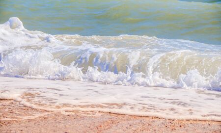 Sea waves. Sea of Crimea. High waves in clear weather. Sunny day at sea. Background blue waves. Sand...