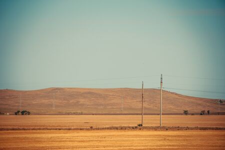 Russian open spaces. Crimea. Field. Summer Russian landscapes. Road views. Grass and sky. Background summer landscape. Crimean fieldsの写真素材