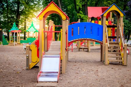 City playground. Children's entertainment. Slides and swings. Happy childhood
