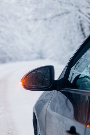 Car in winter in nature outside the city. Snow picture. Snow on the road. Winter road. The white...