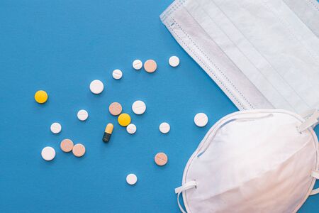 Respirator and medical mask on blueの写真素材