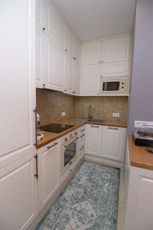 Kitchen in a Scandinavian style . Modern kitchen. Light solid wood Furniture. Interior. The kitchen room . Shelves. Russia, Saint Petersburg 29 February 2020のeditorial素材