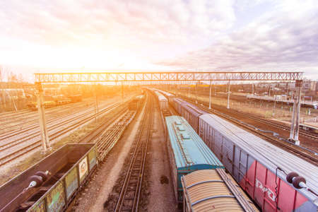 Commodity cars on the railway. Cargo transportation. Panorama of wagons awaiting loading. Russian...