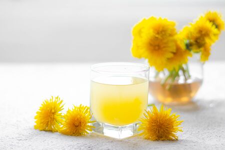 Dandelion tea. Yellow summer flowers dandelions. Tea party Homemade drink. Certified flower tea. Yellow drink. An article about teas. Hot drinks articleの写真素材