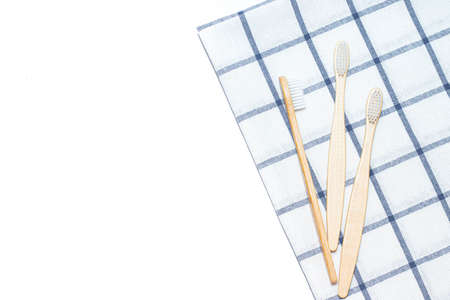 Bamboo toothbrush on a towel. Tooth cleaning. Article about choosing a toothbrush. Article about dental care. Bath accessories.の写真素材