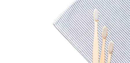 Bamboo toothbrush on a towel. Tooth cleaning. Article about choosing a toothbrush.の写真素材