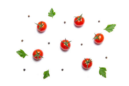 Cherry tomatoes on a white background. Background vegetables. Copy space. Small tomatoes. Article about tomatoes. article about cooking a vegetable dish. decorationの写真素材