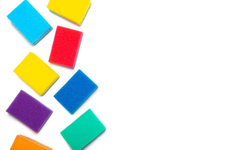 Sponge for washing dishes on a white background . Household items. Clean dishes. Help in the kitchen. Colored sponges. Copy space.の写真素材