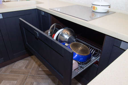 Modern kitchen made of solid black. The kitchen is of solid oak. details. Modern kitchen furniture filling. Furniture to order. The design of the apartment. The black kitchen. Furniture. Russia, Saint Petersburg, new building, April 15, 2020のeditorial素材