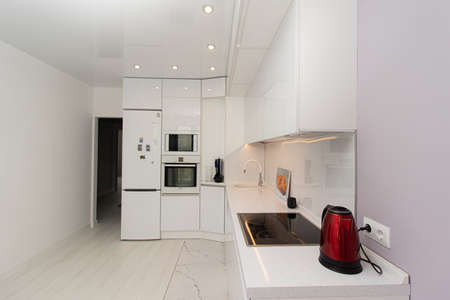 Modern white kitchen. The kitchen is of solid oak. Kitchen details. Modern kitchen furniture filling. Furniture to order. The design of the apartment. Furniture. Russia, Saint Petersburg, new building, may 13, 2020のeditorial素材