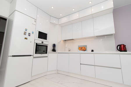 Modern white kitchen. The kitchen is of solid oak. Kitchen details. Modern kitchen furniture filling. Furniture to order. The design of the apartment. Furniture. Russia, Saint Petersburg, new building, may 13, 2020のeditorial素材