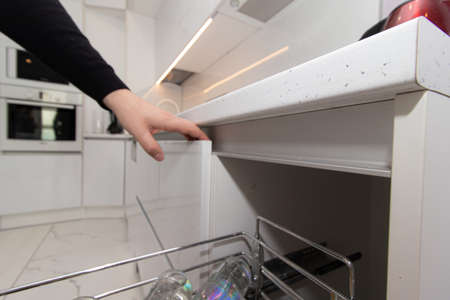 Modern white kitchen. The kitchen is of solid oak. Kitchen details. Modern kitchen furniture filling. Furniture to order. The design of the apartment. Furniture. Russia, Saint Petersburg, new building, may 13, 2020のeditorial素材