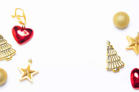 Christmas balls on a white background. The layout of the Christmas toys top view. Copy space. decor. Red and gold toys. White backgroundの写真素材