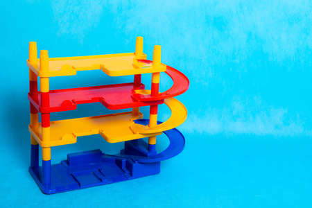 Game for small boys car Parking on a blue background. Game for boys. Plastic games. Off-street Parking. Article about games for boysの写真素材
