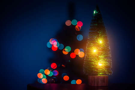 Christmas tree on the background of bokeh lights. Christmas tree. Lights bokeh defocus. New year and Christmas holidays. Holiday article. Copy spaceの写真素材