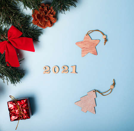 Flatlay Christmas. 2021 from the numbers.The layout of the new 2021. Wooden numbers. Hello new year. Article about new year and Christmas. Keyboard layout. Copy space. Stars. blue background.の写真素材
